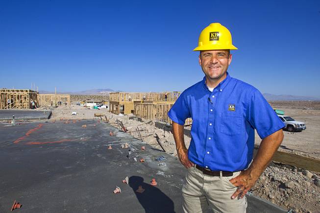 Jeff Spencer, a KB Homes regional construction manager, poses at a worksite at Inspirada in Henderson Tuesday, June 3, 2014. A number of formerly stalled or financially troubled master-planned communities are now back in business, with developers building and selling homes.