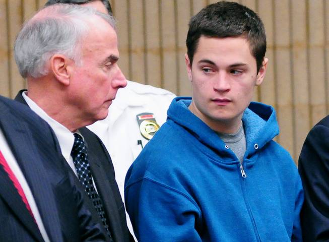 Christopher Plaskon, 16, right, stands with appointed guardian, his uncle Paul Healy, during a hearing in his public court appearance at Superior Court on Friday, May 2, 2014, in Milford, Conn.