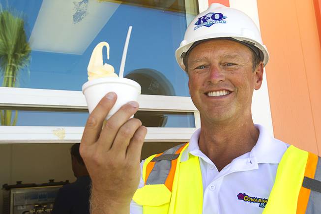 Shane Huish, general manager of the Cowabunga Bay water park, poses with a Dole Pineapple Whip at the park in Henderson Thursday, June 5, 2014. Developers announced that the water park will open July 4. The park includes a 32,000-square-foot wave pool, water slides and a 1,200-foot-long lazy river.