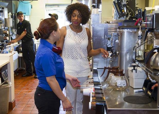 Franchise owner Sharon Lipscomb talks with shift manager Aljonette Nery at her McDonald's restaurant, 65 S Valle Verde Dr., in Henderson Thursday, June 5, 2014. Lipscomb owns five McDonald's.