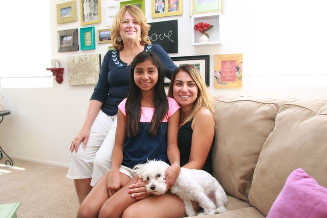 Cancer survivor Jasmine Chavez, 12, her mother Graziella Delatorre and school counselor Nancy Gentis are seen Thursday, June 5, 2014.