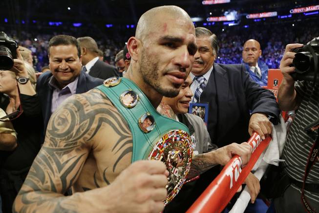 Miguel Cotto, of Puerto Rico, reacts after winning a WBC World Middleweight Title boxing match against Sergio Martinez, of Argentina, Sunday, June 8, 2014, in New York. Cotto won by technical knockout after the ninth round. 
