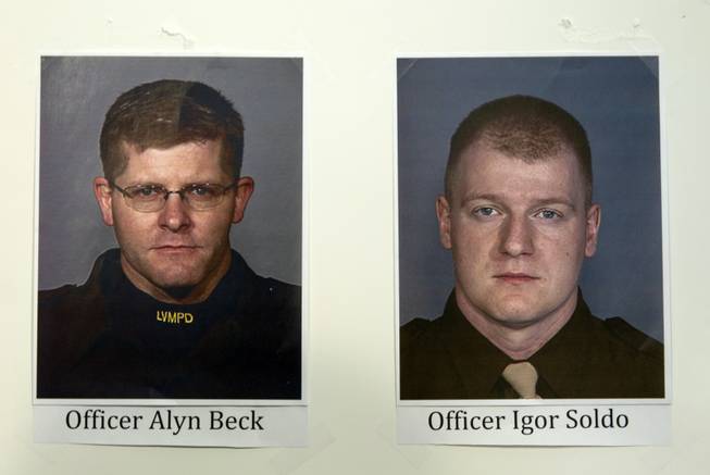 Photos of fallen Metro Police Officers Alyn Beck, left, and Igor Soldo are displayed during a news conference at Metro headquarters following the death of the two officers and a citizen Sunday, June 8, 2014. Two suspects, also dead, shot the officers at CiCi's Pizza on Nellis Boulevard, then fled to a nearby Wal-Mart, where they shot and killed another person before killing themselves.