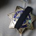 Metro shooting shrouded badge
