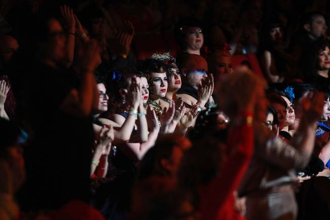 Audience members applaud a performance during the 2014 Burlesque Hall of Fame's Tournament of Tease competition Saturday, June 7, 2014 at the Orleans.