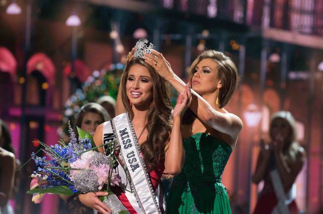 2014 Miss Nevada USA Nia Sanchez is crowned 2014 Miss USA by 2013 Miss USA Erin Brady of Connecticut at the 2014 Miss USA Pageant at Baton Rouge River Center on Sunday, June 8, 2014, in Baton Rouge, La.