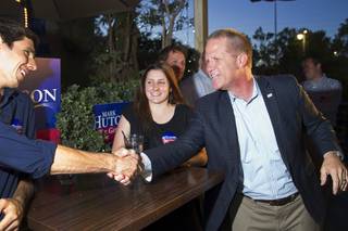 Mark Hutchison, right, Republican candidate for Lt. Governor, greets supporters during an primary election night party at Dom Demarco's Pizzeria Tuesday, June 10, 2014.