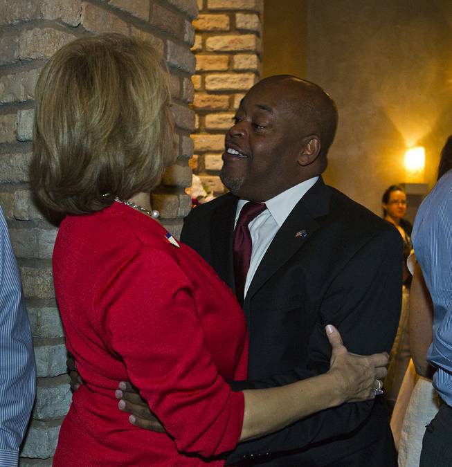Lieutenant governor candidate Sue Lowden greets Congressional candidate Niger Innis for the 4th District as Republicans are gathered at Mundo restaurant on Monday, June 9, 2014.