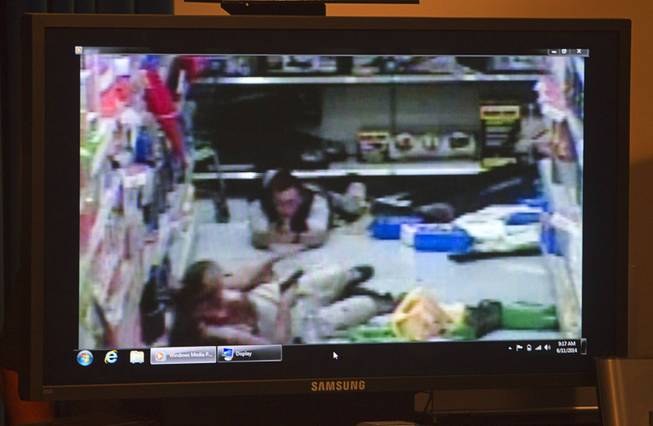 Wal-Mart store surveillance video of shooting suspects is shown during a news conference at Metro Police headquarters Wednesday, June 11, 2014. Police provided new details on Sunday's shooting that resulted in five deaths, including two police officers and a civilian.