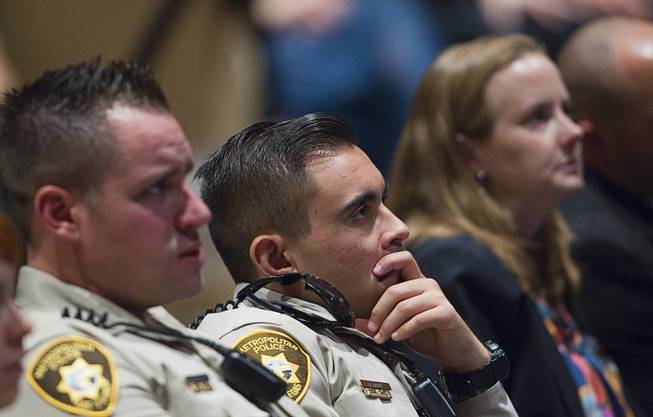 Metro Police officers and family members watch a video presentation during services for Metro Police officer Igor Soldo at Canyon Ridge Church Thursday, June 12, 2014. Soldo and Metro Police Officer Alyn Beck where ambushed and killed by Jerad and Amanda Miller while eating lunch on Sunday, June 8.