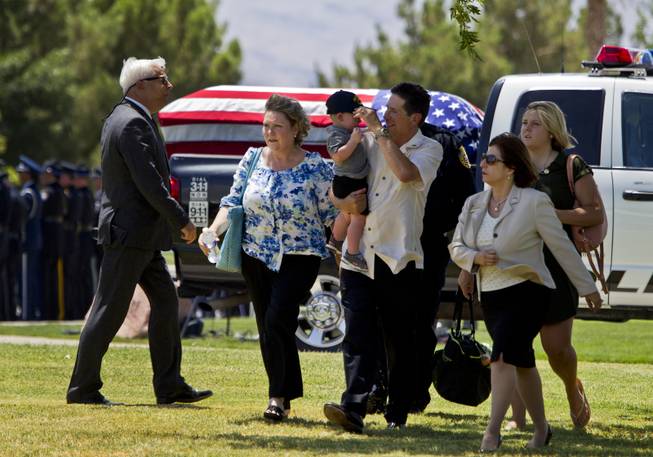 Family members and supporters begin to gather for the funeral services for slain Metro Officer Igor Soldo at the Palm Mortuary on Thursday, June 12, 2014.