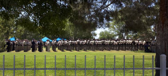 Metro Officers stand in formation as the funeral services for slain Metro Officer Igor Soldo continue at the Palm Mortuary on Thursday, June 12, 2014.