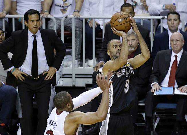 San Antonio Spurs guard Tony Parker (9) shoots against the Miami Heat in the first half in Game 4 of the NBA finals Thursday, June 12, 2014, in Miami. 