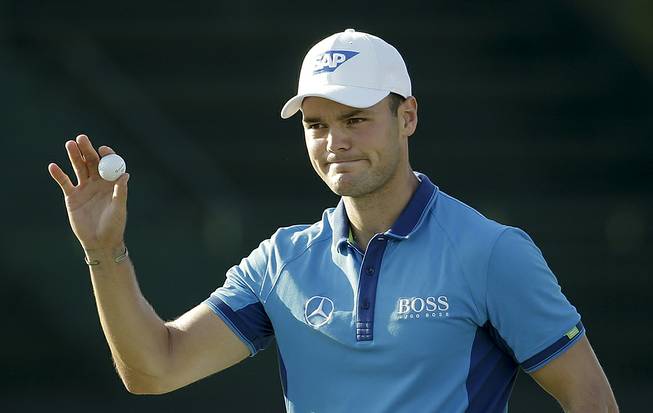 Martin Kaymer, of Germany, waves after shooting 65 in the first round of the U.S. Open golf tournament in Pinehurst, N.C., Thursday, June 12, 2014. 