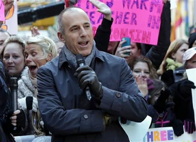 In this 2013 photo, Matt Lauer, co-host of NBC's "Today," appears in New York's Rockefeller Center. NBC said Friday, June 13, 2014, that Lauer has agreed to a contract extension for multiple years, although it would not specify how long. Lauer’s future with the show, which is currently second behind ABC’s “Good Morning America” in the ratings, was the biggest question hanging over the news division.