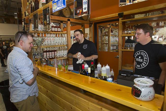 Bartenders Cody Fredrickson, left, and Travis Nichol mix bourbon cocktails during "Bourbon Day" at the Las Vegas Distillery in Henderson Saturday, June 14, 2014. The "Nevada 150" bourbon whiskey, the first bourbon produced in Nevada, is named for Nevada's sesquicentennial.