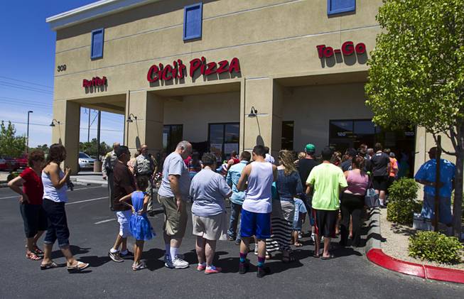 People line up for lunch during "Sharing Our Support," a fundraiser for the families of Metro Police Officers Igor Soldo and Alyn Beck, at CiCi's Pizza Sunday, June 15, 2014. The officers were ambushed and killed at the restaurant while eating lunch on Sunday, June 8. One hundred percent of the Sunday sales will go the families of the fallen officers and Joseph Willcox, the victim killed at the Wal-Mart, said store owner Mike Haskins.