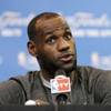 Miami Heat forward LeBron James responds to a question during a media availability for the NBA basketball finals on Saturday, June 14, 2014, in San Antonio.