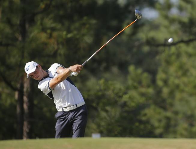 Martin Kaymer of Germany watches his tee shot on the 10th hole during the final round of the U.S. Open golf tournament in Pinehurst, N.C., Sunday, June 15, 2014.