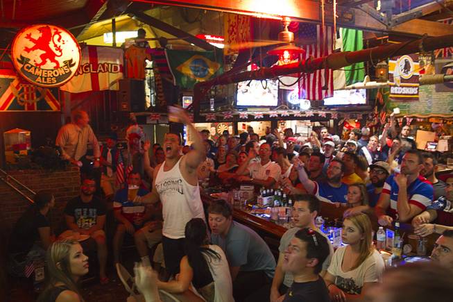 Soccer fans watch the United States play Ghana 2-1 in the World Cup during a viewing party at the Crown & Anchor British Pub Monday, June 16, 2014.