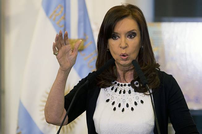 Argentine President Cristina Fernandez gives a speech, aired on national TV, during an event at the Casa Rosada government palace in Buenos Aires, Argentina, Feb. 12, 2014. President Fernandez said Monday, June 16, 2014, that Argentina can't comply with U.S. court orders to pay $1.5 billion to winners of a decade-long legal battle over defaulted debt.