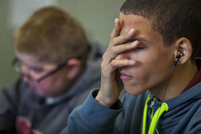 Darius Martin does his best to concentrate on his studies as he and friend Colton Shrum study at Odyssey Charter School on Tuesday, January, 28, 2014.