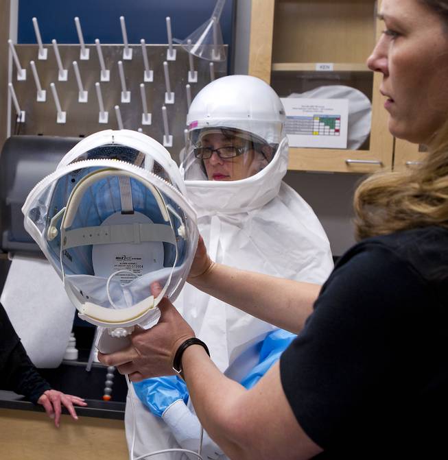 The hoods are ventilated for full Personal Protective Equipment (PPE) worn in the BSL-3 laboratory at the Southern Nevada Public Health Laboratory on Wednesday, June 11, 2014.