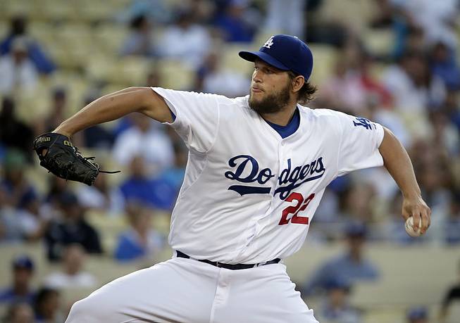 Los Angeles Dodgers starting pitcher Clayton Kershaw throws against the Colorado Rockies during first inning of a baseball game in Los Angeles, Wednesday, June 18, 2014. 