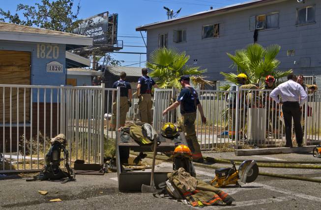 Las Vegas Fire & Rescue begin to mop up an apartment fire at 1820 East Lewis Ave. on Thursday. , June, 19, 2014.