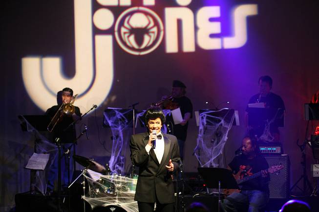 A Wayne Newton impersonator (Kelly Clinton Holmes) performs during a benefit show for Jerry Jones at Lounge at the Palms on Wednesday, June 18, 2014.