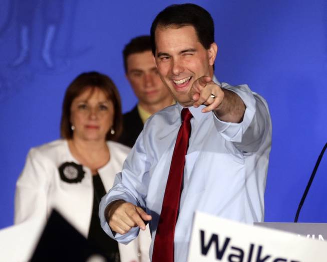 In this June 5, 2012, file photo Wisconsin Republican Gov. Scott Walker reacts at his victory party in Waukesha, Wis., after winning a recall election.