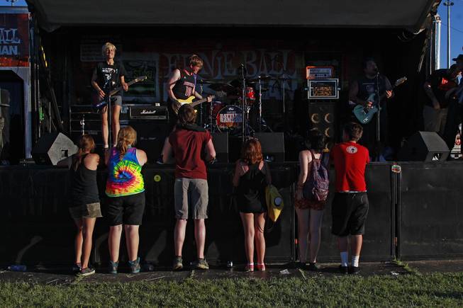 A half dozen fans are seen on hand for the start of Cincinnati band Mixtapes set during the Las Vegas stop of the Vans Warped Tour Thursday, June 19, 2014.