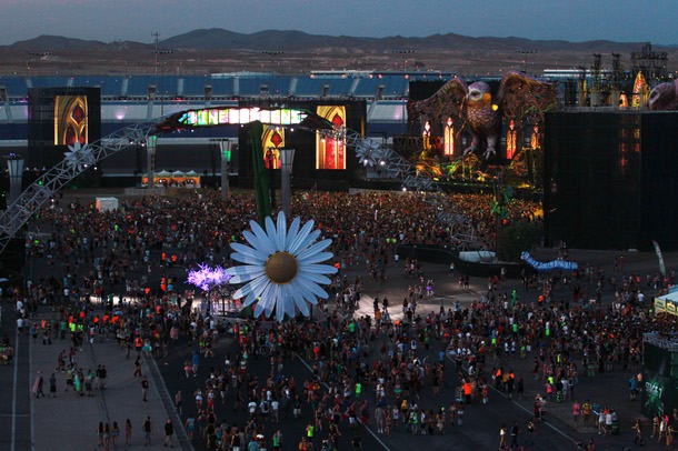 Attendees make their way to the Kinetic Field stage during the first night of the Electric Daisy Carnival Friday, June 20, 2014 at the Las Vegas Motor Speedway.