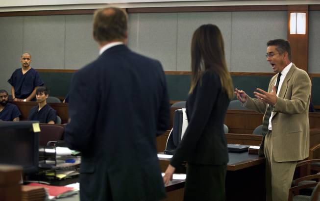 Attorneys argue as Julio Renteria stands before the judge during his preliminary hearing at the Justice Center with Adrian McClintock on Friday, June 20, 2014. The two are suspects in a Boulder Highway carjacking gone awry that ended in Dylan Joshua Salazar's fatal shooting.