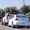 Vehicles marked "Tribal Police" and uniformed personnel post themselves at the parking lot entrances of the Rolling Hills Casino in an attempt to shut down its operations in Corning, Calif., Monday, June 9, 2014. The Northern California Native American casino is at the center of a tense tribal dispute. 