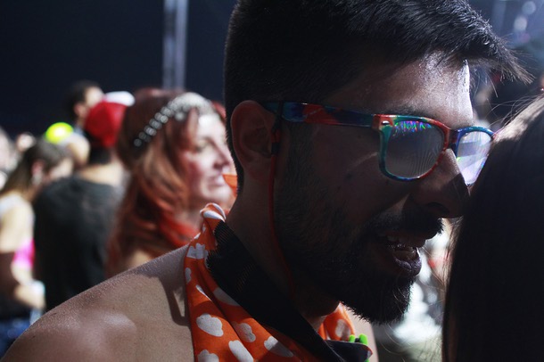 A man talks to a friend during the first night of the Electric Daisy Carnival Saturday, June 21, 2014 at the Las Vegas Motor Speedway.