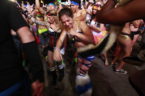 Attendees dance during the first night of the Electric Daisy Carnival Saturday, June 21, 2014 at the Las Vegas Motor Speedway.