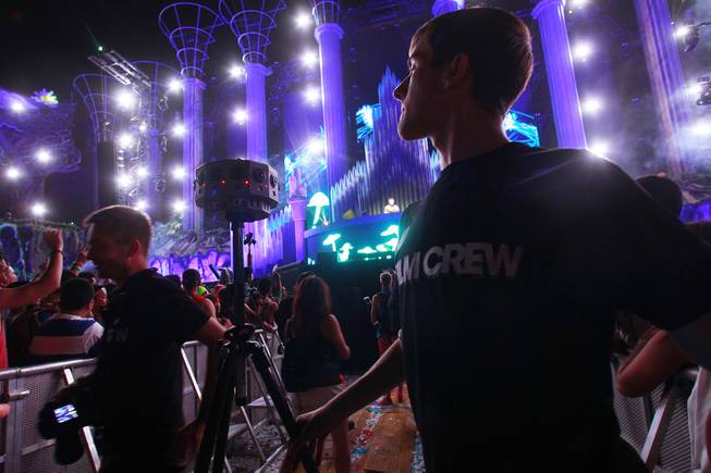 Andon Espeseth from Jaunt VR checks a camera he is using to take a 360 degree, 3D panorama for the Oculus Rift virtual reality headset during the first night of the Electric Daisy Carnival early Saturday, June 21, 2014 at the Las Vegas Motor Speedway.