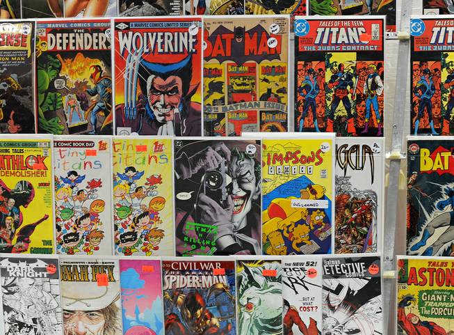 Comic books old and new are displayed for sale in a booth during the first day of the Las Vegas Comic Con at the South Point Convention Center on Saturday, June 21, 2014.