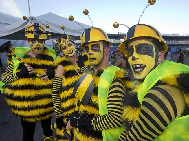 Performers, a queen bee and worker bees, attend the final day of the 2014 Electric Daisy Carnival on Sunday, June 22, 2014, at Las Vegas Motor Speedway.