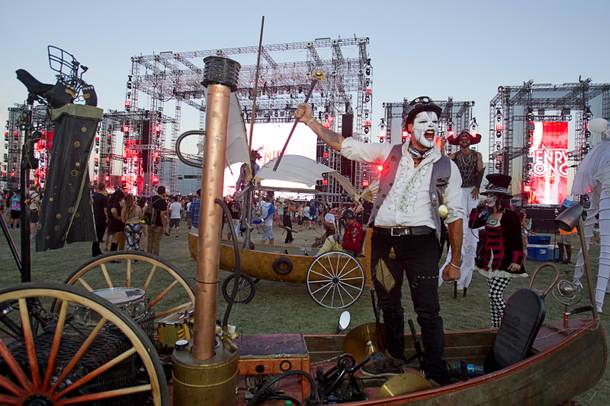 Performer Arthur Noden, a member of Dragon Knights, is shown in a pedal-powered canoe during the final day of the 2014 Electric Daisy Carnival (EDC) at the Las Vegas Motor Speedway Sunday, June 22, 2014.