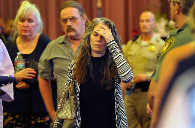 Debra Wilcox, mother of of Joseph Wilcox, exits the chapel after a memorial service at Palm Downtown Mortuary and Cemetery on Sunday, June 22, 2014. Wilcox, 31, was killed trying to stop Jerad and Amanda Miller in the midst of their shooting spree at an east valley Walmart store on June 8.