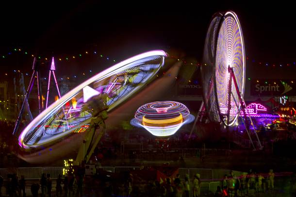 Carnival rides spin during the final night of the 2014 Electric Daisy Carnival (EDC) at the Las Vegas Motor Speedway Sunday, June 22, 2014.
