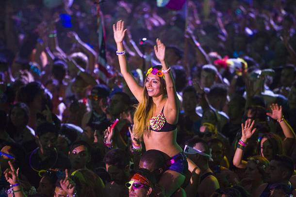 A woman listens to music by Calvin Harris at the Circuit Grounds stage during the final night of the 2014 Electric Daisy Carnival on Sunday, June 22, 2014, at Las Vegas Motor Speedway.