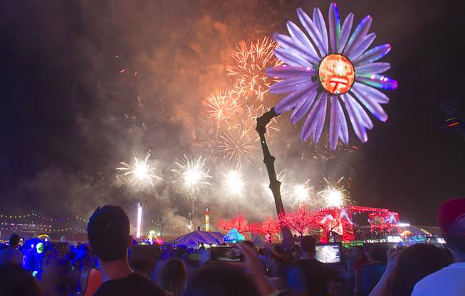 Attendees watch fireworks during the final night of the 2014 Electric Daisy Carnival on Sunday, June 22, 2014, at Las Vegas Motor Speedway. 