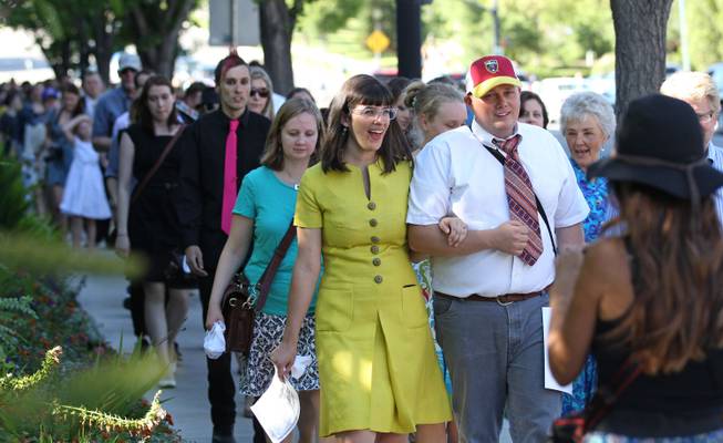 Kate Kelly, center, walks with supporters to the Church Office Building of the Church of Jesus Christ of Latter-day Saints during a vigil Sunday, June 22, 2014, in Salt Lake City.