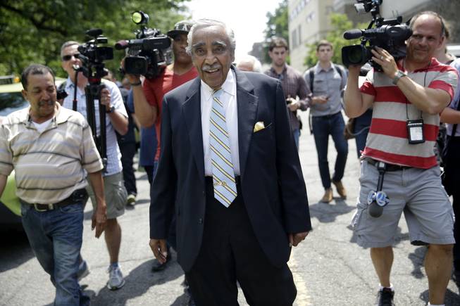 Congressman Charles Rangel is followed by reporters in New York, Monday, June 23, 2014.