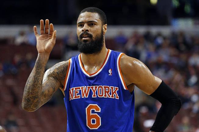 In this March 21, 2014, photo, New York Knicks' Tyson Chandler gestures during an NBA basketball game against the Philadelphia 76ers in Philadelphia. 