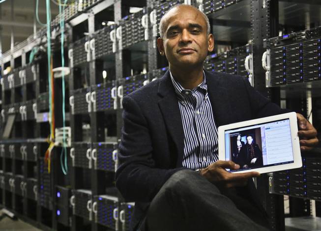 This Dec. 20, 2012, file photo shows Chet Kanojia, founder and CEO of Aereo, Inc., holding a tablet displaying his company's technology, in New York.