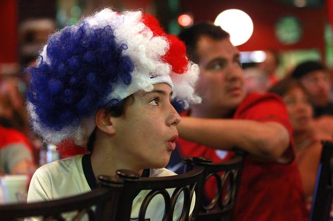 Josue Ruiz, who recently returned from attending early World Cup matches in Brazil, reacts while watching at Shakespeare's Grille & Pub as the United States takes on Germany in their Group G game at the World Cup in Brazil Thursday, June 26, 2014.